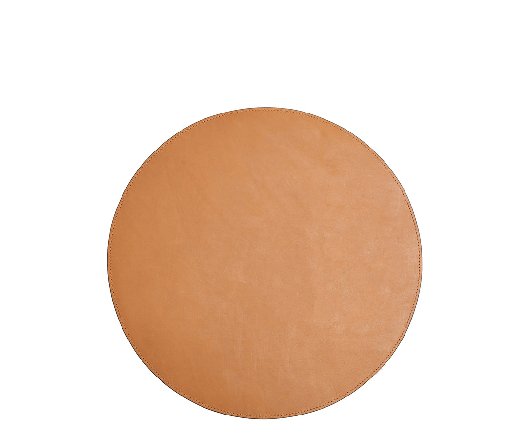 Tan Leather circular placemat Add richness and depth to your dining table with the Nelson leather placemat. The Nelson is handcrafted with American full-grain leather and is backed with a non-skid durable rubber mat. #color_tan
