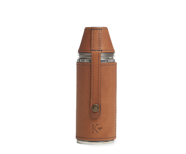 Espresso Leather bottle flask Crafted with sturdy stainless steel and wrapped in American full-grain leather, the Radcliff leather bottle flask oozes style and convenience. The Radcliff leather bottle flask includes 4 stainless steel serving cups as well as a stainless steel flask funnel for easy filling.