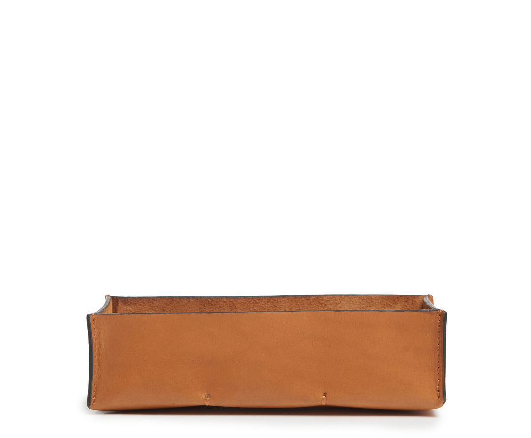 Tan Leather desk tray Keep your pencils, pens and other small office essentials organized and easily at reach with the Litton leather pencil tray. The Litton is handcrafted with top-quality full-grain American leather and uses whip-stitches to help form a secure flat base. #color_tan