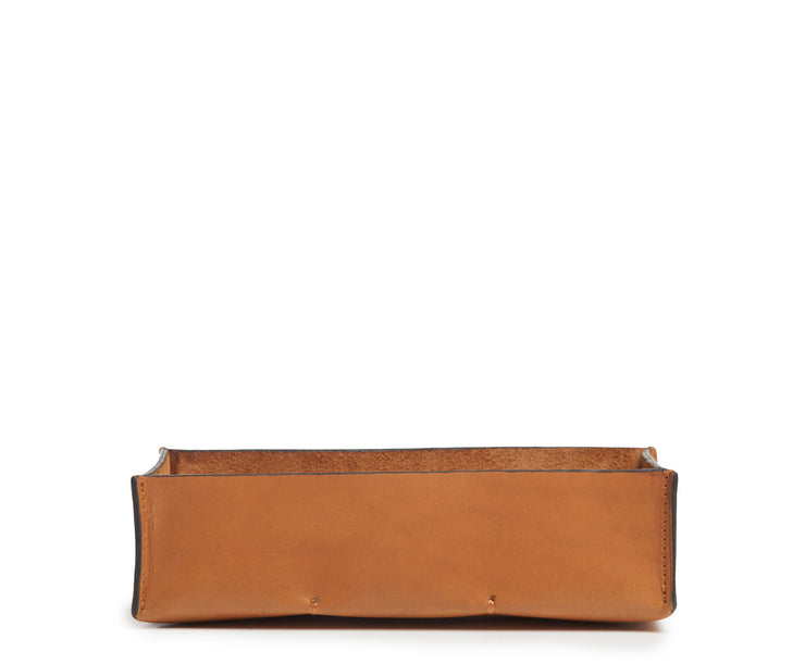 Tan Leather desk tray Keep your pencils, pens and other small office essentials organized and easily at reach with the Litton leather pencil tray. The Litton is handcrafted with top-quality full-grain American leather and uses whip-stitches to help form a secure flat base.