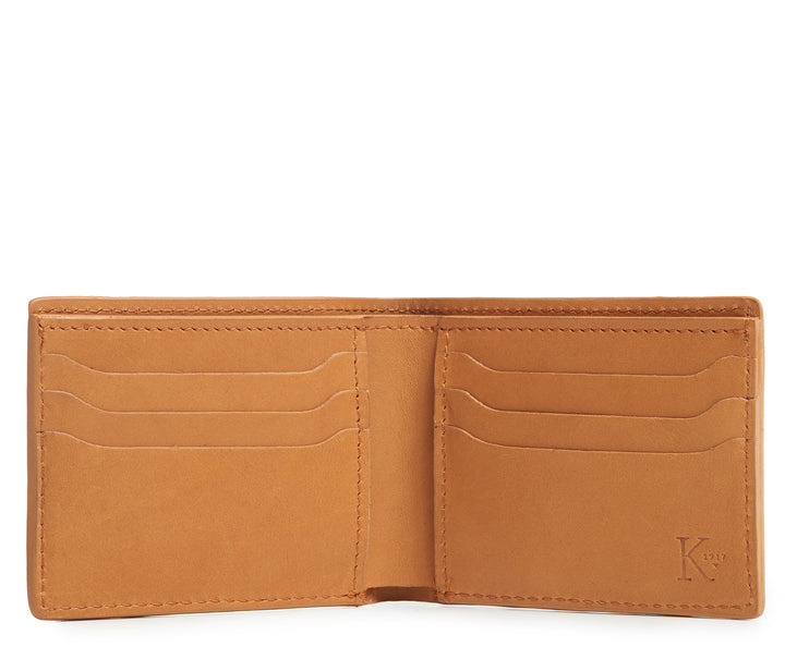 Tan Hover Slim leather wallet Handcrafted with American full-grain vegetable tanned leather Slim but full featured with 6 credit card pockets One vertical stash pockets Scalloped shape card slots to allow for easy card recognition All edges are hand burnished and inked Fully lined bill compartment for easy entry and exit of bills Dimensions: 3.5" x .5" x 4.5"
