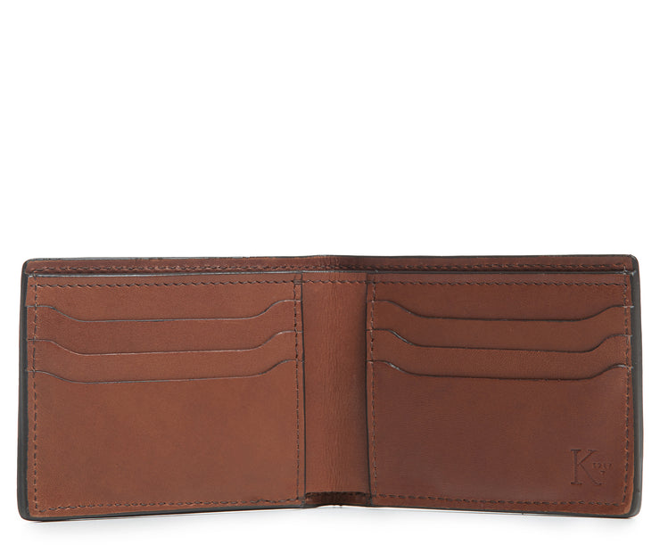 Espresso Hover Slim leather wallet Handcrafted with American full-grain vegetable tanned leather Slim but full featured with 6 credit card pockets One vertical stash pockets Scalloped shape card slots to allow for easy card recognition All edges are hand burnished and inked Fully lined bill compartment for easy entry and exit of bills Dimensions: 3.5" x .5" x 4.5"