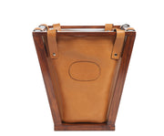 Tan Leather wastebasket Here's a wastebasket you won't want to hide in the corner or under a desk. The Winslow leather wastebasket features full-grain American leather that is suspended securely on a beautiful pine wood frame. The Winslow leather wastebasket has a 4-gallon capacity and is the perfect size for your home office, bedroom or bathroom