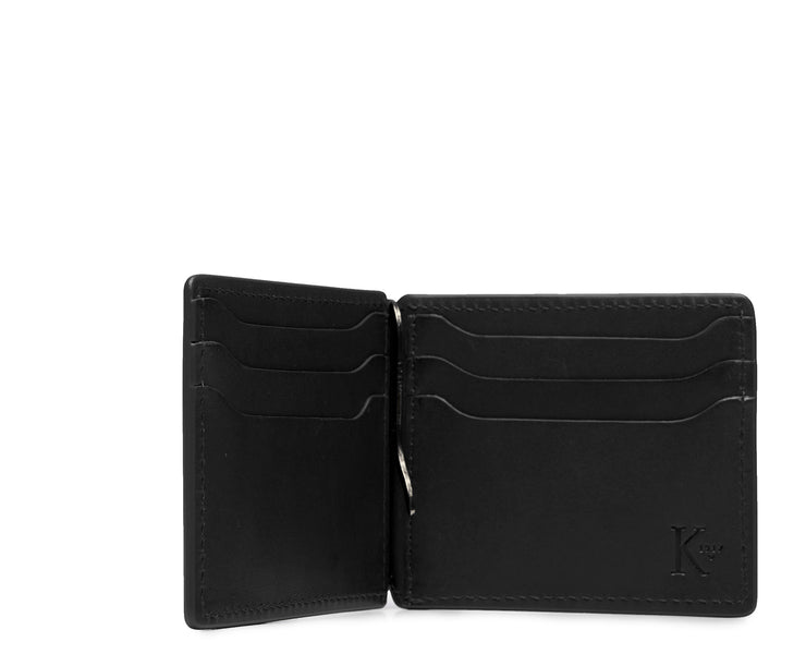 Black Handcrafted with American full-grain vegetable tanned leather One full length bill pocket with leather lined back 6 credit card slots with scalloped shape for easy card recognition 2 vertical stash pockets All edges are hand burnished and inked Dimensions: 3.25" x .5" x 4.5"