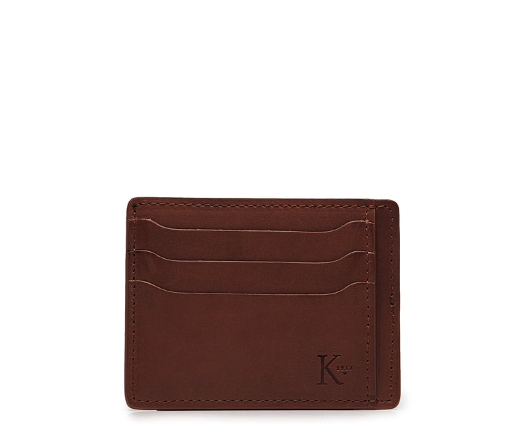 Brown Slim leather wallet Handcrafted with full-grain vegetable tanned leather, this slim wallet is designed with simplicity and functionality in mind. Made to slip easily into back pockets, the Knox has six scalloped credit card slots and two vertical stash pockets.