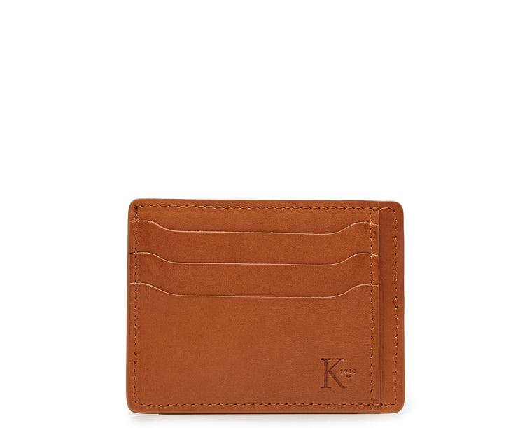 Tan Slim leather wallet Handcrafted with full-grain vegetable tanned leather, this slim wallet is designed with simplicity and functionality in mind. Made to slip easily into back pockets, the Knox has six scalloped credit card slots and two vertical stash pockets.