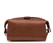 Brown Full grain American leather Antique nickel hardware Snap down ends, which allow for expansion Fully lined with signature 6.4 oz yarn dyed twill Zipper length of 13.25" Handcrafted with care in our own factory Dimensions: 11" x 5" x 6"