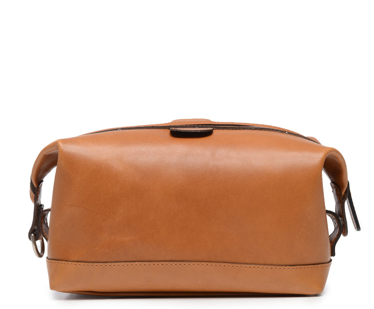 Tan Full grain American leather Antique nickel hardware Snap down ends, which allow for expansion Fully lined with signature 6.4 oz yarn dyed twill Zipper length of 13.25" Handcrafted with care in our own factory Dimensions: 11" x 5" x 6"