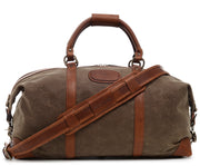Olive Premium waxed canvas with full grain American leather trim Antiqued solid brass hardware Unique "clamp down" ends allow roomy main compartment to expand Fully lined with signature 6.4 oz yarn dyed twill Interior zippered pockets Removable, adjustable shoulder strap with ergonomic pad Customizable monogram patch on exterior Handcrafted with care in our own factory Dimensions: 22" x 10" x 14"