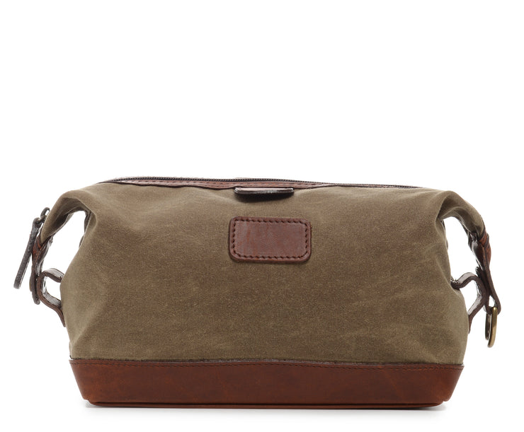Olive Waxed Canvas Dopp Kit The Ryder is a compact waxed canvas toiletry bag with full grain leather trim. This Dopp Kit features a top zipper and snap down ends that allow for maximum expansion.