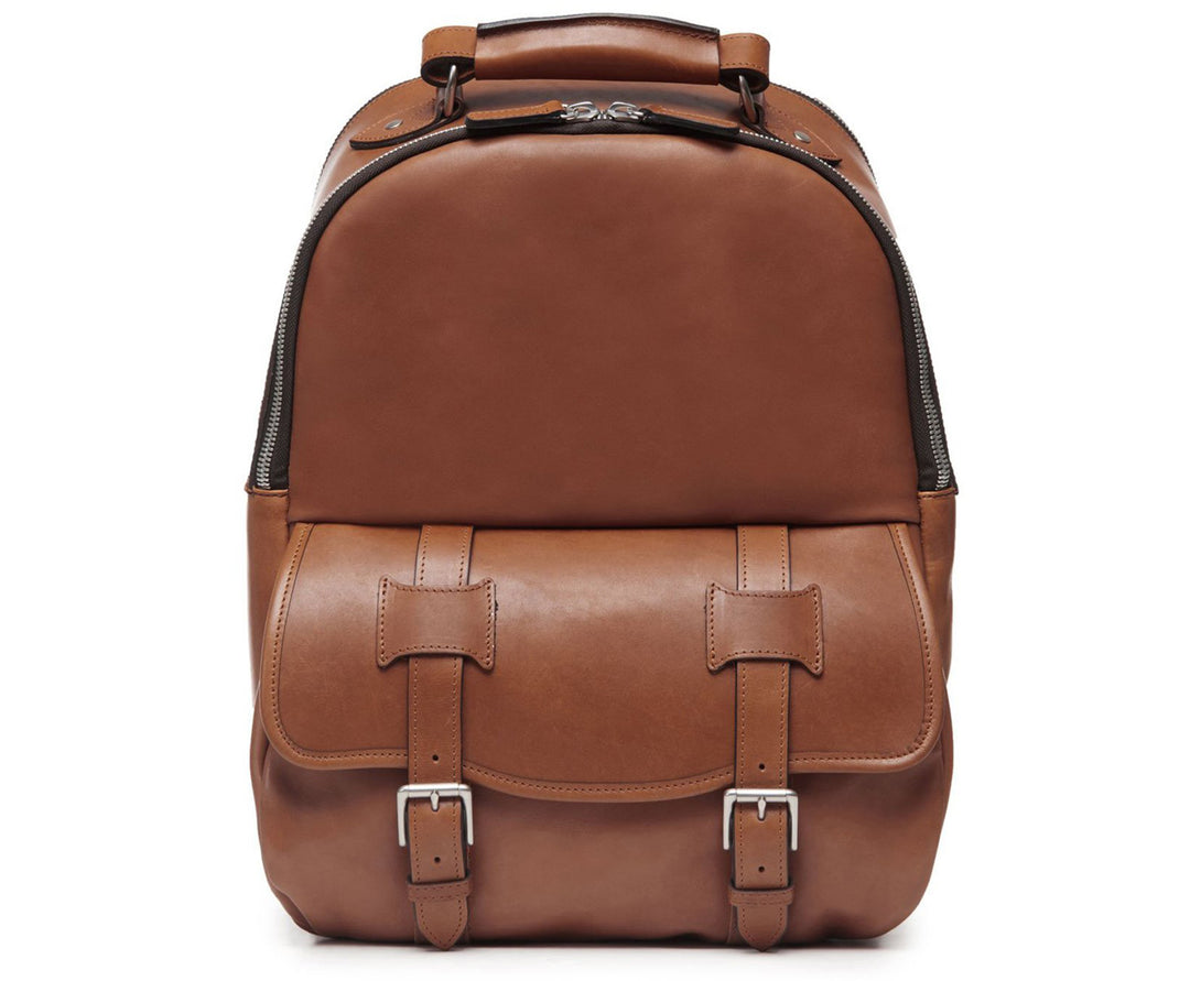 Brown Classic Leather Backpack The Lewis in Korchmar's Classic Leather is made of American cowhide leather that is selected from the top 5% of available hides. Colored only with aniline dyes, this leather retains its natural beauty over time and features visible markings that are characteristic of only the finest leather. A classic backpack silhouette, the Lewis is designed with both daily commutes and weekend excursions in mind. #color_brown