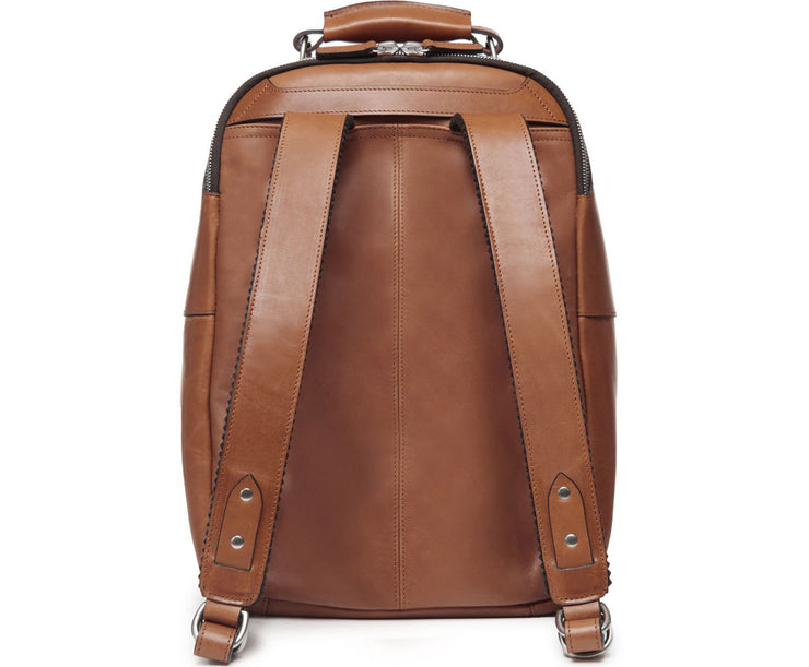 Brown Handcrafted with full grain American leather Padded backpack shoulder straps Roomy interior and front pocket Keychain attachment Interior organizer panel Fits up to a 15" laptop  Strap designed for easy carry on telescoping luggage handles Handcrafted with care in our own factory Natural leather lining Dimensions: 17" x 7" x 12"