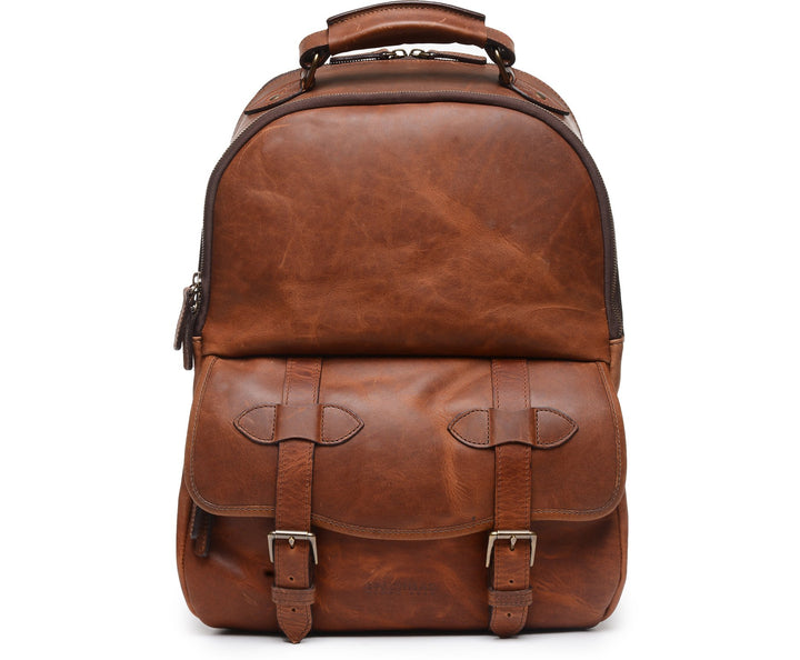 Espresso Leather Backpack A classic backpack silhouette handcrafted in Korchmar’s best-selling Espresso leather, the Lewis is designed with both daily commutes and weekend excursions in mind. Featuring a roomy front zipped pocket, the Lewis is accented with solid antique brass hardware, and lined with natural leather. #color_espresso
