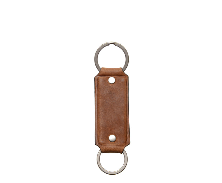 Espresso Hover Full grain mill dyed American leather Steel key rings Handcrafted with care in our own factory Dimensions: 5" x 1.25"