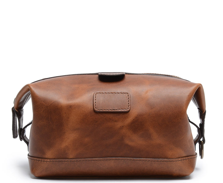 Espresso Leather Dopp Kit The Ryder is a compact leather toiletry bag made with full grain leather. This Dopp Kit features a top zipper and snap down ends that allow for maximum expansion. #color_espresso