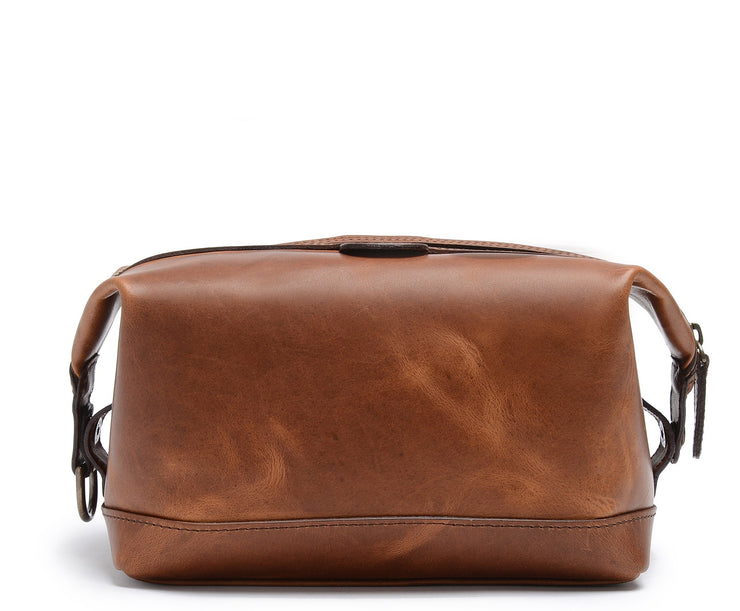 Espresso Full grain American leather trim Antique brass hardware Snap down ends, which allow for expansion Fully lined with signature 6.4 oz yarn dyed twill Zipper length of 13.25" Handcrafted with care in our own factory Made in the USA Dimensions: 11" x 5" x 6"
