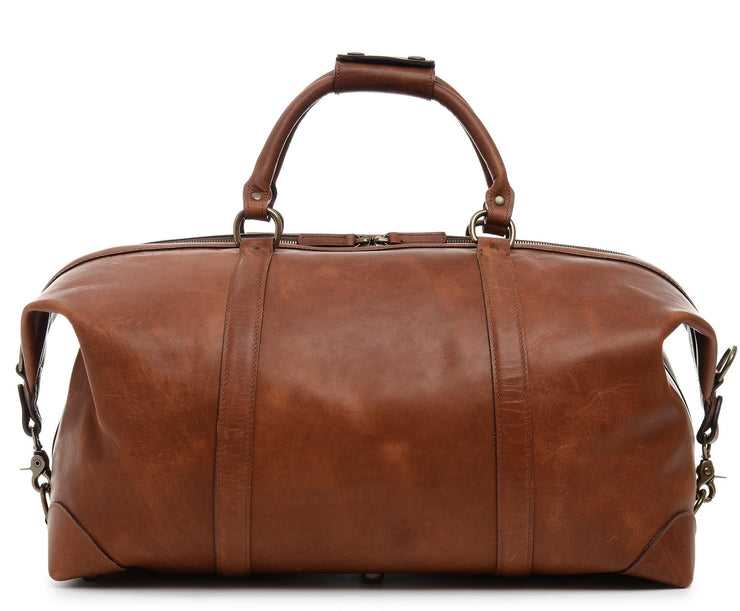 Espresso One of our best-selling weekender styles, the Twain is ideal for leisure or business travel. At 22", it is designed to fit comfortably in most airline overhead compartments. The Twain leather duffel bag is handcrafted in the USA with full grain leather that develops a beautiful patina with time. It includes a removable, adjustable shoulder strap.