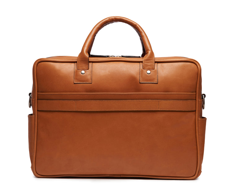 Tan Lightweight construction, handcrafted with American full-grain leather 2 main compartments Multiple organizational pockets, including a cell phone pocket, two additional exterior pockets, and an interior zippered pocket Reinforced roller bag attachment strap that lays flat when not in use Solid brass zipper and hardware with a nickel finish Dimensions: 16" x 4.75" x 12"