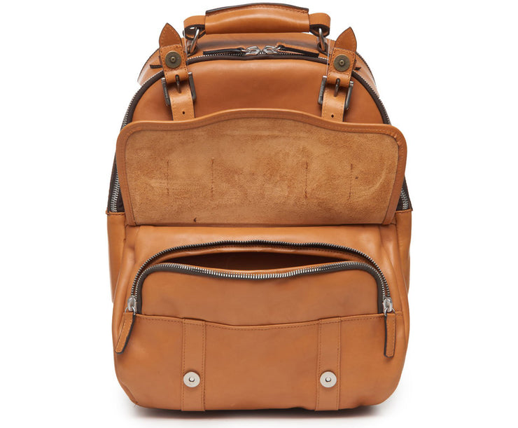 Tan Handcrafted with full grain American leather Padded backpack shoulder straps Roomy interior and front pocket Keychain attachment Interior organizer panel Fits up to a 15" laptop  Strap designed for easy carry on telescoping luggage handles Handcrafted with care in our own factory Natural leather lining Dimensions: 17" x 7" x 12"