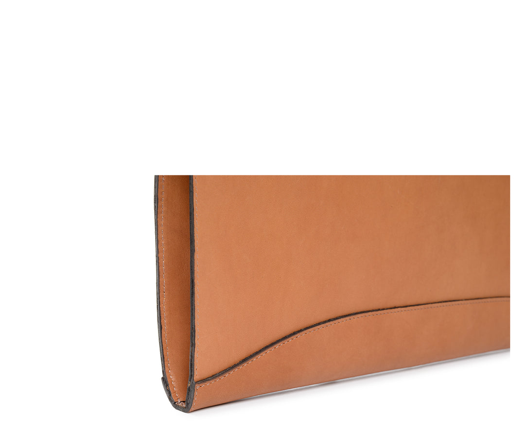 Tan Full grain American oil tanned saddle leather Solid 5 oz. thick unlined interior Zips on two sides for easy access Handcrafted with care in our own factory  Dimensions: 17" x 1.5" x 12" #color_tan