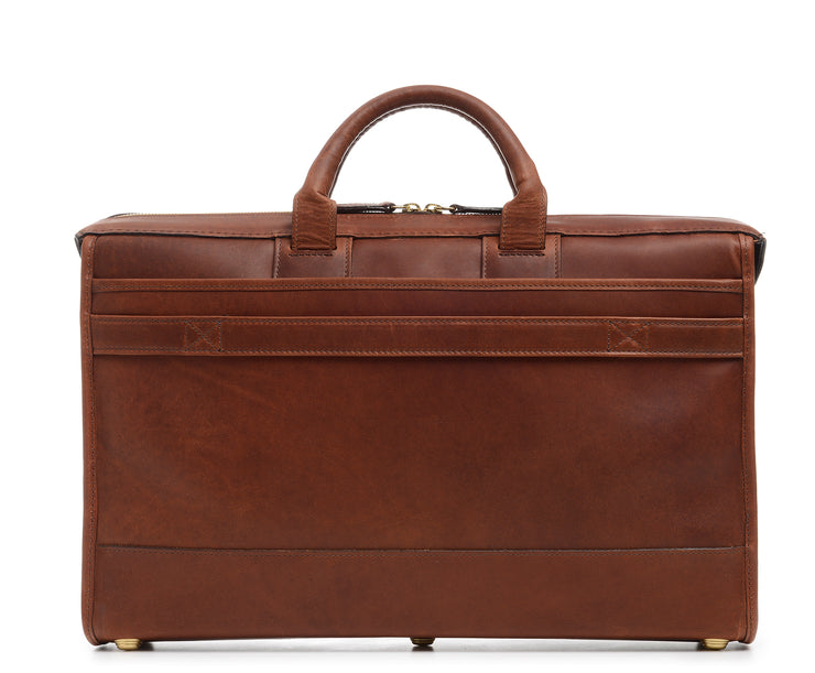 Espresso Full grain American leather finished with natural oils and waxes Single interior compartment Multiple interior pockets expand to accommodate a cell phone, laptop charger, and other small personal items Built in iPad Sleeve Exterior back flat pocket and front zip pocket