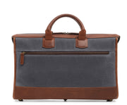 Grey Slim Waxed Canvas Laptop Briefcase The Sawyer's slim, refined silhouette make it perfect for carrying most 15" laptops and small personal items. Carry it by hand or over the shoulder with the included removable, adjustable shoulder strap. The Sawyer is handcrafted with water-resistant waxed canvas and trimmed with full-grain leather.
