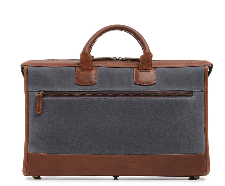 Grey Slim Waxed Canvas Laptop Briefcase The Sawyer's slim, refined silhouette make it perfect for carrying most 15" laptops and small personal items. Carry it by hand or over the shoulder with the included removable, adjustable shoulder strap. The Sawyer is handcrafted with water-resistant waxed canvas and trimmed with full-grain leather.