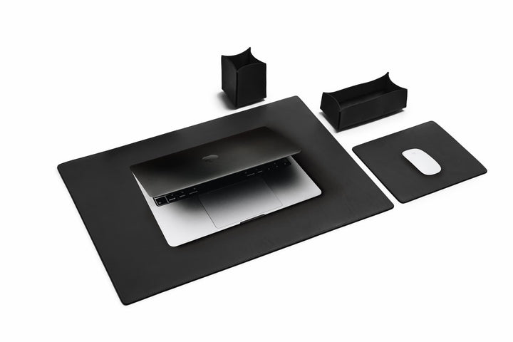 Black Leather desk set Take your work-from-home setup to new heights with our full-grain leather desk set. Featuring our handcrafted desk pad, mouse pad, pencil tray and pencil cup, this handsome set will help keep your workspace refined and organized. #color_black