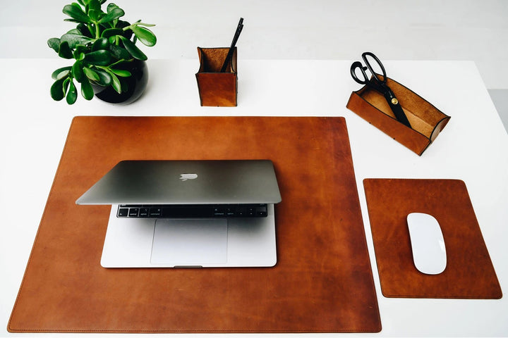 Full-grain American leather Backed with non-skid durable rubber mat Each desk pad's selection is one-of-a-kind and slightly unique given the natural characteristics of the leather Handcrafted with care in our own factory Dimensions: 24" W x 17.5" H