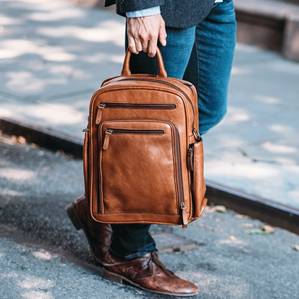 The Graham commuter backpack brings modern features and functionality to a classic design. Handcrafted with American full-grain leather, this meticulously appointed backpack offers extensive organizational capacity in a sleek, compact silhouette. The Graham features nine convenient exterior pockets, two of which offer easy access to a water bottle, sunglasses, or other on-the-go items. The Graham commuter backpack is designed to accommodate most 15” laptops.