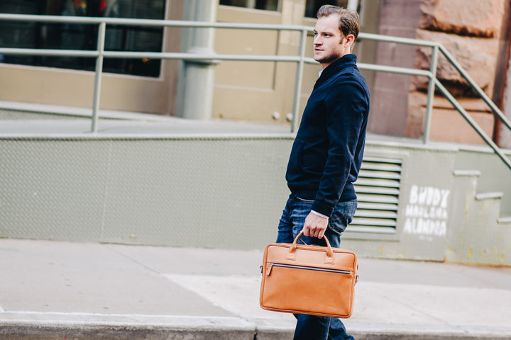 The Dylan leather briefcase features a removable, adjustable shoulder strap and built-in computer sleeve. It is designed with a secure top zipper, and can safely accommodate most 15" laptops.