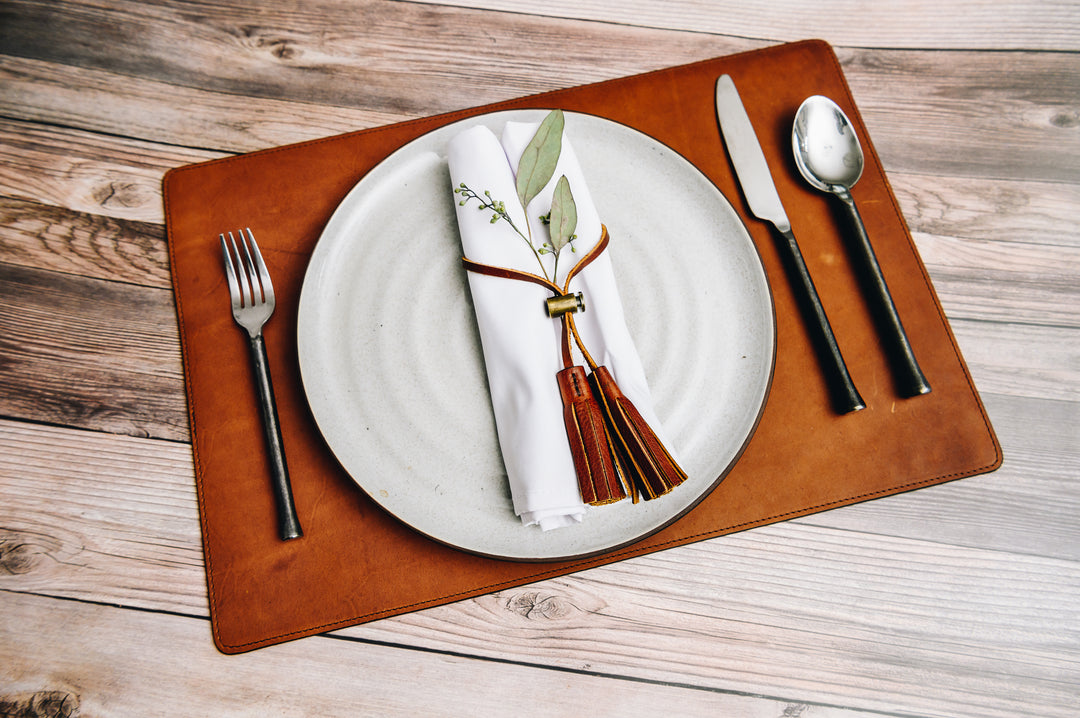 Full-grain American leather Backed with non-skid durable rubber mat Each placemat's selection is one-of-a-kind and slightly unique given the natural characteristics of the leather