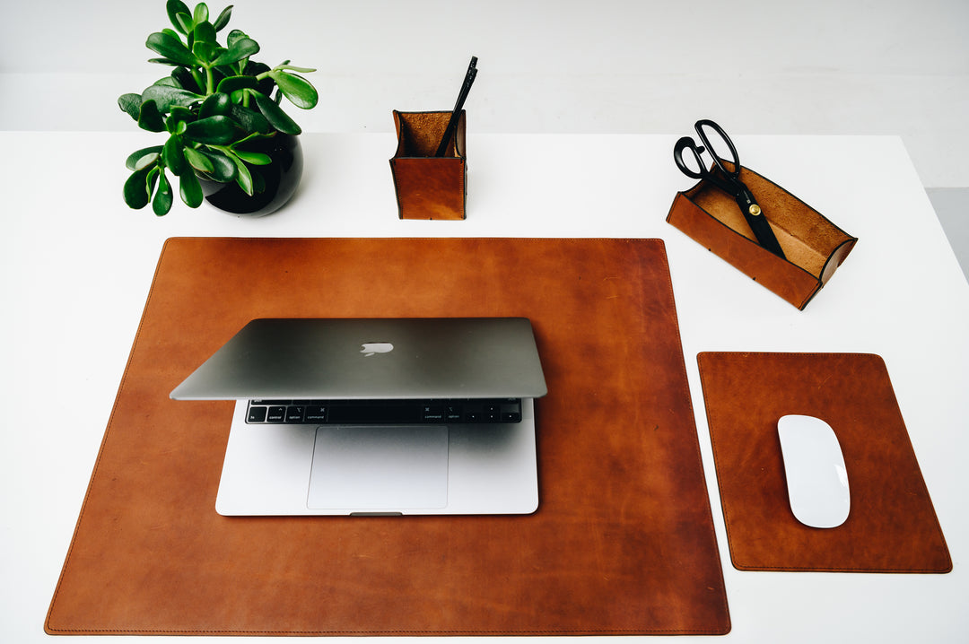 Take your work-from-home setup to new heights with our full-grain leather desk set. Featuring our handcrafted desk pad, mouse pad, pencil tray and pencil cup, this handsome set will help keep your workspace refined and organized.