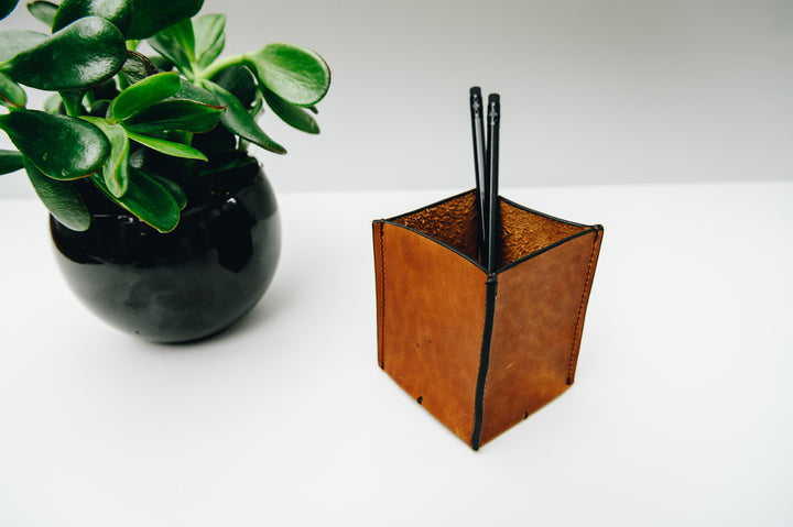 A simple but elegant addition to your desk setup, the Leland leather pencil cup helps keep your pencils, pens and other small office essentials organized. The Leland is handcrafted with top-quality full-grain American leather and uses whip-stitches to help form a secure flat base.