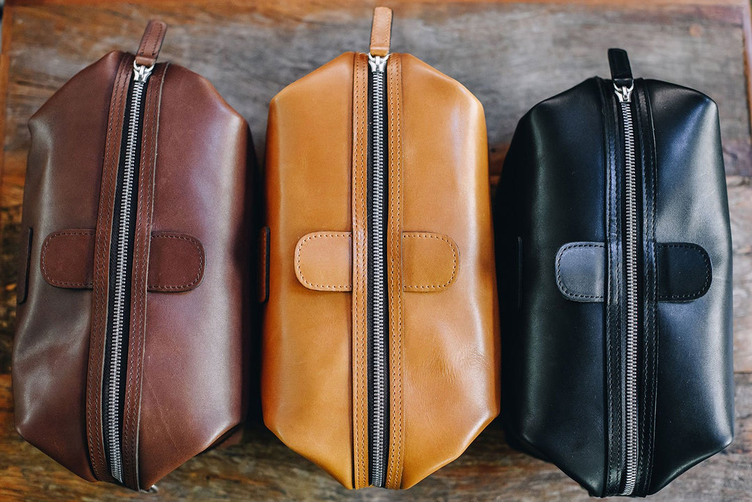 The Ryder dopp kit in Korchmar's Classic Leather is made of American cowhide leather that is selected from the top 5% of available hides. Colored only with aniline dyes, this leather retains its natural beauty over time and features visible markings that are characteristic of only the finest leather. The Ryder features a top zipper and snap down ends that allow for maximum expansion.