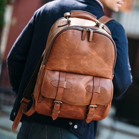 A classic backpack silhouette handcrafted in Korchmar’s best-selling, the Lewis is designed with both daily commutes and weekend excursions in mind. Featuring a roomy front zipped pocket, the Lewis is accented with solid antique brass hardware, and lined with natural leather. The Lewis’s roomy interior also includes an organizer panel, ideal for storing cords, sunglasses, a passport, and other small personal items. The Lewis backpack is designed to accommodate most 15” laptops.