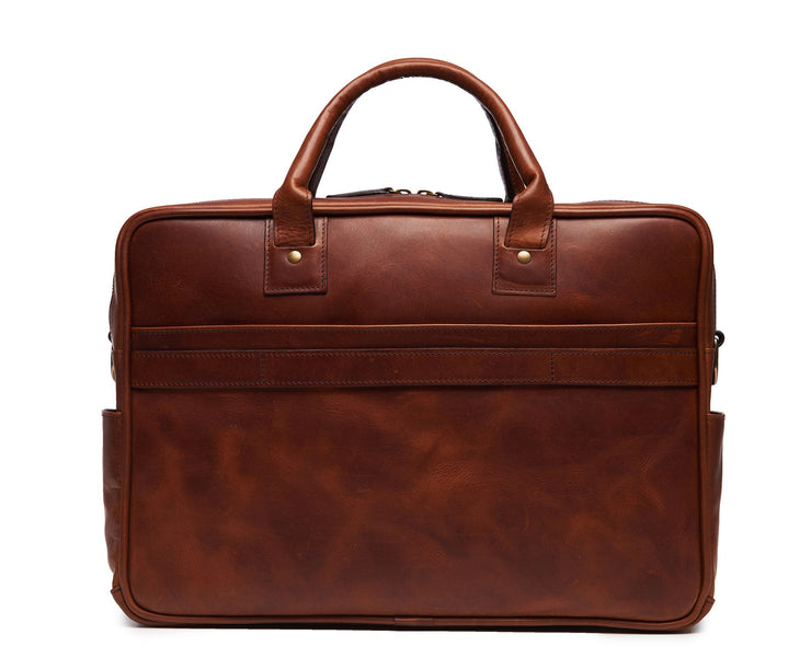 Espresso Lightweight construction, handcrafted with American full-grain leather 2 main compartments Multiple organizational pockets, including a cell phone pocket, two additional exterior pockets, and an interior zippered pocket Reinforced roller bag attachment strap that lays flat when not in use Solid brass zipper and hardware Dimensions: 16" x 4.75" x 12"
