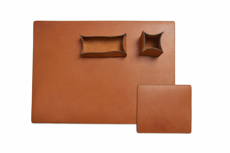 Tan Leather desk set Take your work-from-home setup to new heights with our full-grain leather desk set. Featuring our handcrafted desk pad, mouse pad, pencil tray and pencil cup, this handsome set will help keep your workspace refined and organized.