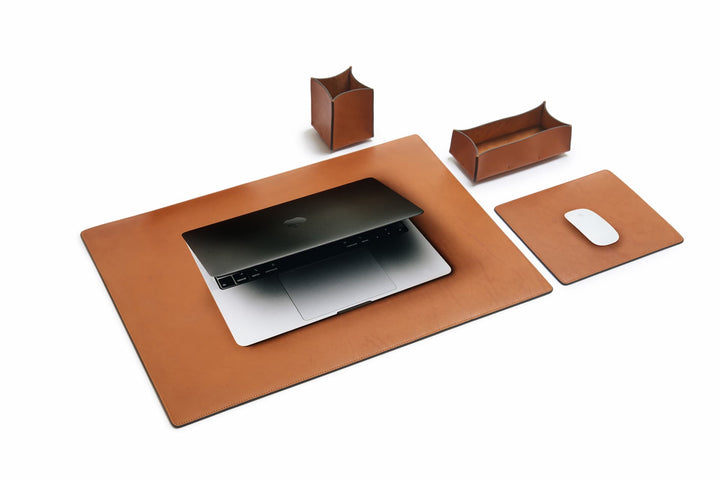 Tan Leather desk set Take your work-from-home setup to new heights with our full-grain leather desk set. Featuring our handcrafted desk pad, mouse pad, pencil tray and pencil cup, this handsome set will help keep your workspace refined and organized. #color_tan