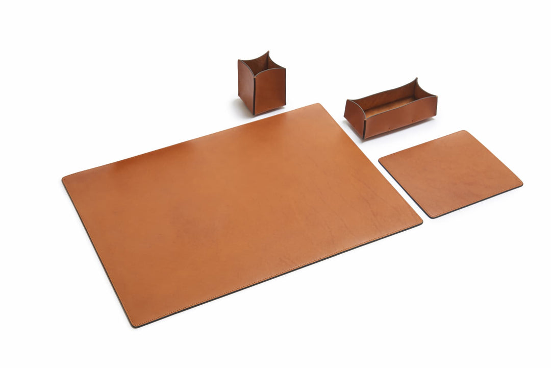 Tan Leather desk set Take your work-from-home setup to new heights with our full-grain leather desk set. Featuring our handcrafted desk pad, mouse pad, pencil tray and pencil cup, this handsome set will help keep your workspace refined and organized. #color_tan