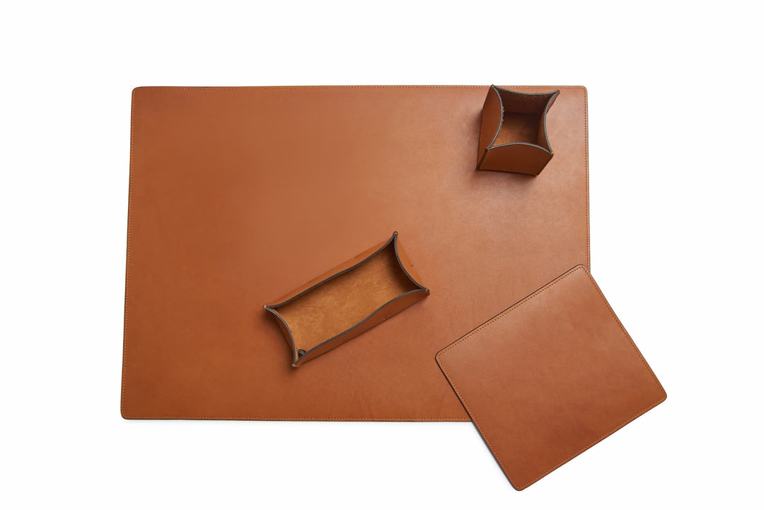 Tan Leather desk set Take your work-from-home setup to new heights with our full-grain leather desk set. Featuring our handcrafted desk pad, mouse pad, pencil tray and pencil cup, this handsome set will help keep your workspace refined and organized. #color_tan
